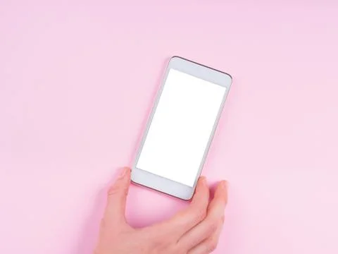 Hand with smartphone screen on pink Stock Photos
