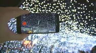 The Hand With A Smartphone Shot The Bright Lights. Real Time Capture Stock Footage
