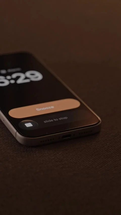 Hand Snoozing Alarm on Smartphone in Bed. Stock Footage 340967549