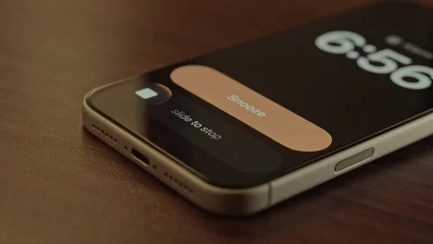 Hand Snoozing Alarm on Smartphone in Bed. Stock Footage 340967580