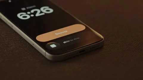 Hand Snoozing Alarm on Smartphone in Bed. Stock Footage 340967620