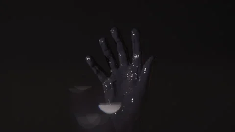 Hand Soaked in Black Paint Stock Footage 208802416
