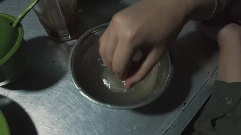 Hand Soaking in Water Bowl, Close Up Stock Footage 301025569