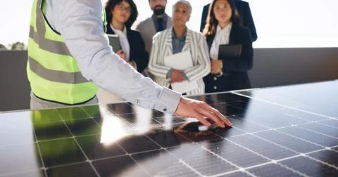 Hand, solar panel and engineer with business people outdoor for photovoltaic Foto stock