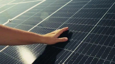 Hand on Solar Panel Close-Up Illustrating Clean Energy Production from the Sun Stock Footage 289727597