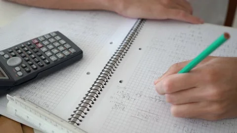 Hand Solving Algebraic Problem On A Math Notebook With Scientific Stock Footage 148697319