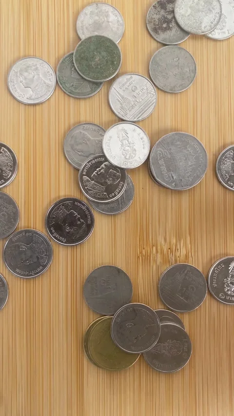 Hand Sorting Coins on Wooden Table for Savings and Budget Planning Video stock 336974147