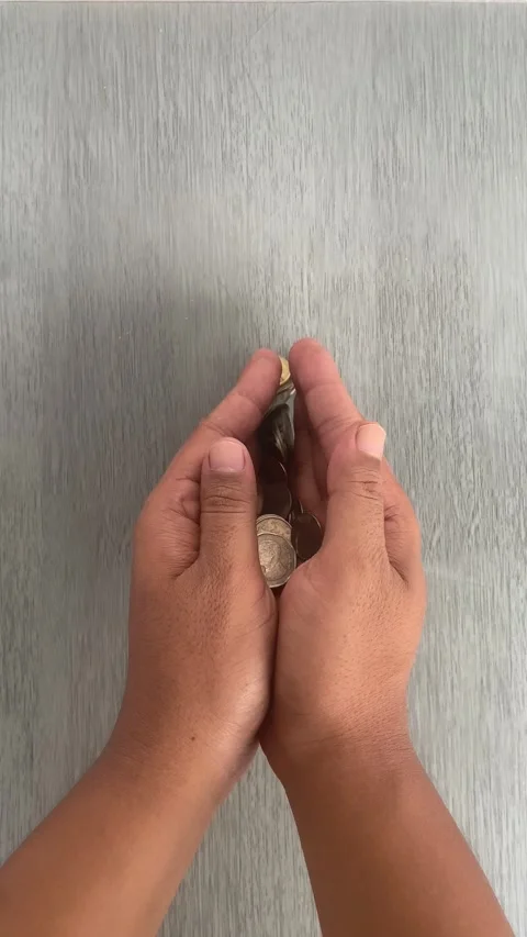 Hand Sorting Coins on Wooden Table for Savings and Budget Planning Video stock 336974153