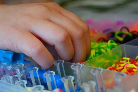 Hand sorting colorful rubber bands Fotos Stock