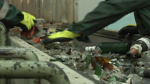 Hand sorting of glass in a Mixed Waste Processing Facility. Stock-Footage 61526649