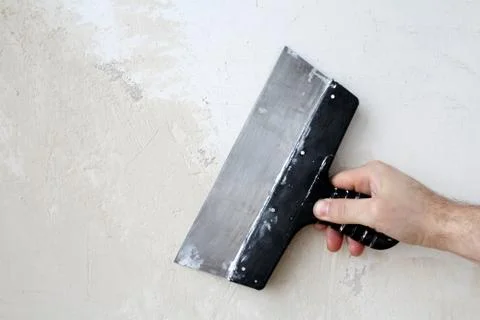 Hand with a spatula Foto stock