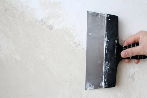 Hand with a spatula Stock Photos