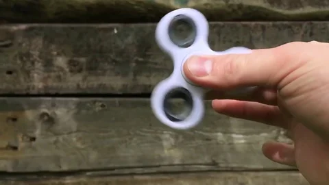 Hand spinner closeup Stock Footage 78783952