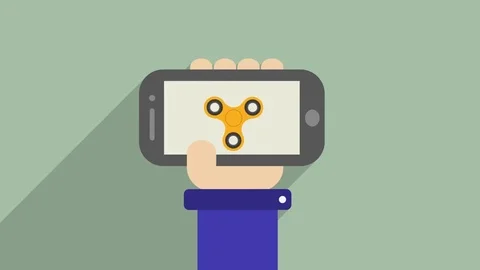 Hand spinner in the phone Stock Footage 78784391