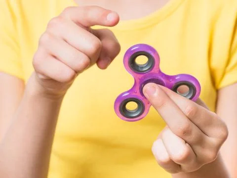 Hand with spinner Stock Photos
