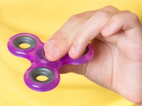 Hand with spinner Stock Photos