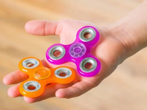 Hand with spinner Stock Photos