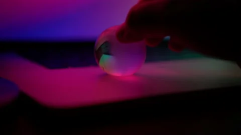 Hand spinning globe around computer neon light abstract concept digital era c Stock Footage 198659838