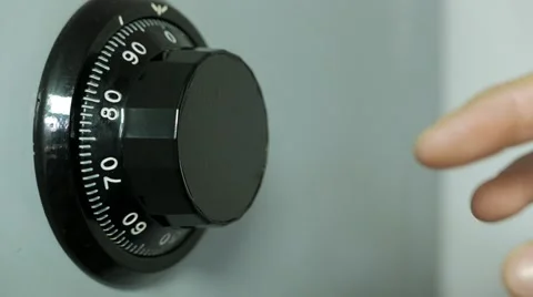 Hand spinning wheel on the combination of the safe Stock Footage 61483647