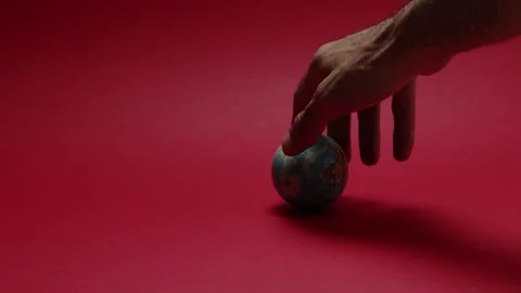 A hand that spins a planet ball Stock Footage 198372087