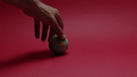 A hand that spins a planet ball Stock Footage 198372220