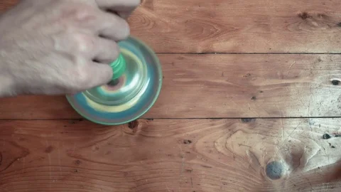 The hand spins Yulu Stock Footage 74196417