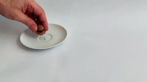 Hand Splits Walnut to Reveal Nut Inside- Minimalist Setup Stock Footage 320098177