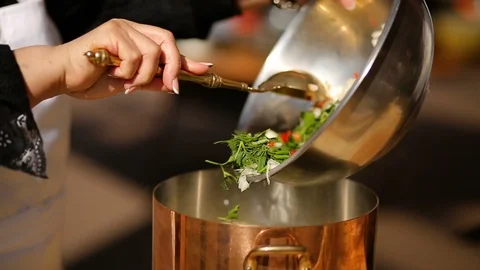 Hand with a spoon stirs vegetable soup. Cooking process. close-up Stock Footage 90465115