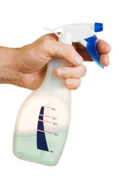 Hand with spray bottle Stock Photos