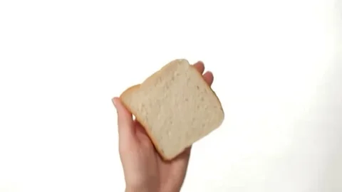 Hand Spreading Chocolate Cream on a Slice of Toast on white background Stock-Footage 98248113