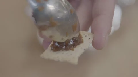 Hand Spreading Chutney on Cracker at Sydney Market Food Stall, Close Up Stock Footage 345715971