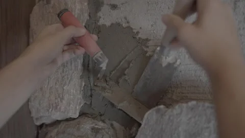 Hand spreads mortar on scratch coat 動画素材 339283932