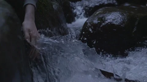 Hand In Spring Water Slowmotion Stock Footage