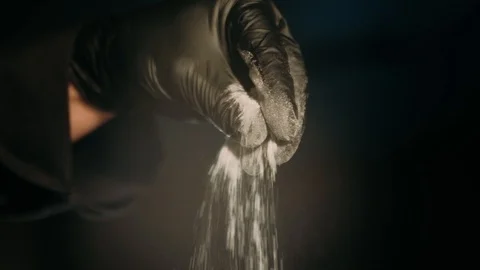 Hand sprinkling salt Stock Footage 125458687