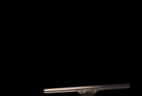 Hand with squeegee wipes screen at an angle Stock Footage 754626