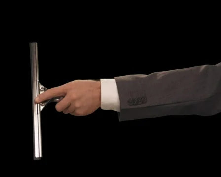 Hand with squeegee wipes screen left to right Stock Footage 754622