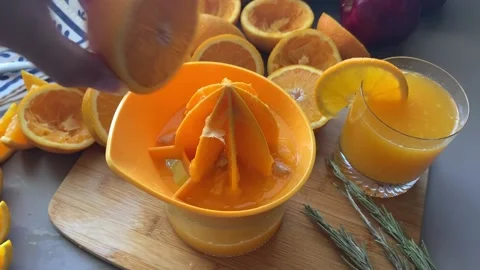 Hand Squeeze Orange Juice Stock Footage 134357882
