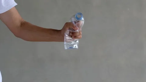 Hand squeezed disposable plastic bottles. Recycling Concept Stock-Footage 132973154