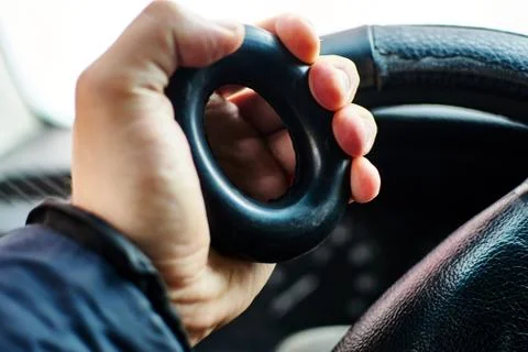 A hand squeezes an expander. Stock Photos