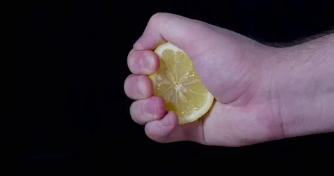 Hand squeezes a lemon Stock Footage 237370863