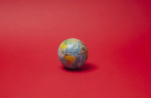 A hand that squeezes a planet ball Stock Photos