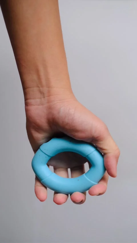 Hand Squeezing Blue Silicone Grip Ring for Strength Training , 4 Stock Footage 291031108