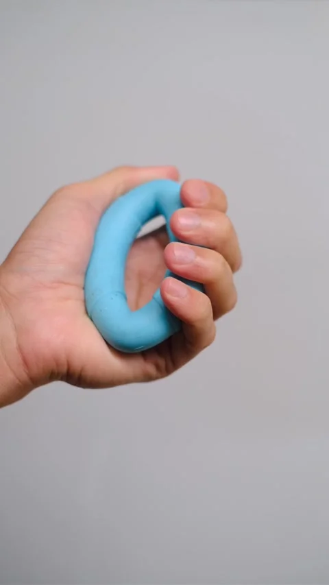 Hand Squeezing Blue Silicone Grip Ring for Strength Training, 5 Stock Footage 291031113