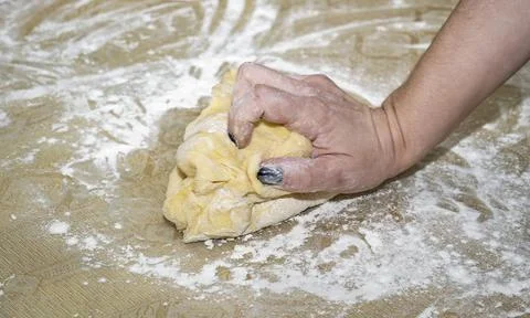 A hand squeezing the dough Stock Photos