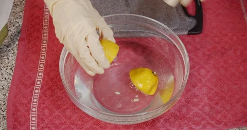 Hand Squeezing  fresh Lemon Stock Footage 128979304