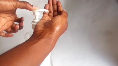 Hand Squeezing Hand Sanitizer and Showing it Stock Footage 141152268