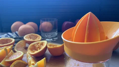 Hand Squeezing Orange Juice Stock Footage 134356913