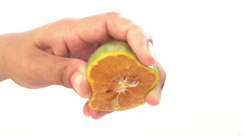 Hand squeezing an orange. Slow motion Stock Footage 58010295