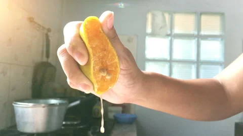 Hand squeezing an orange. Slow motion Stock Footage 58124907