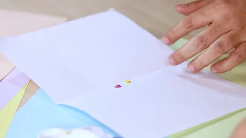 Hand Squeezing Paint Onto Paper for Art Preparation Stockbeeldmateriaal 318948987